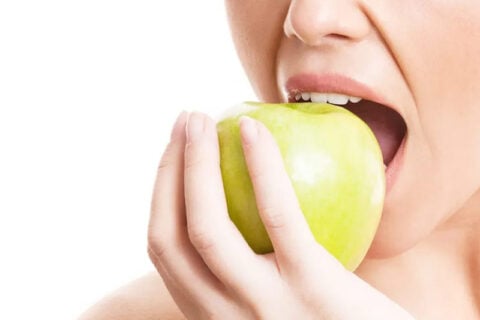women eating apple